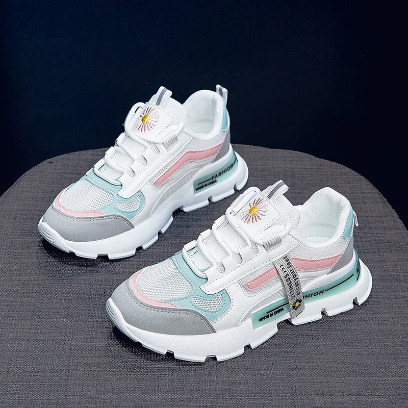Stylish female lace up sneakers in pastel colors with thick soles, perfect for casual wear and spring outings.