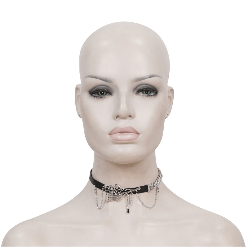 Black leather choker with asymmetrical spider web design and silver chain on a mannequin's neck.