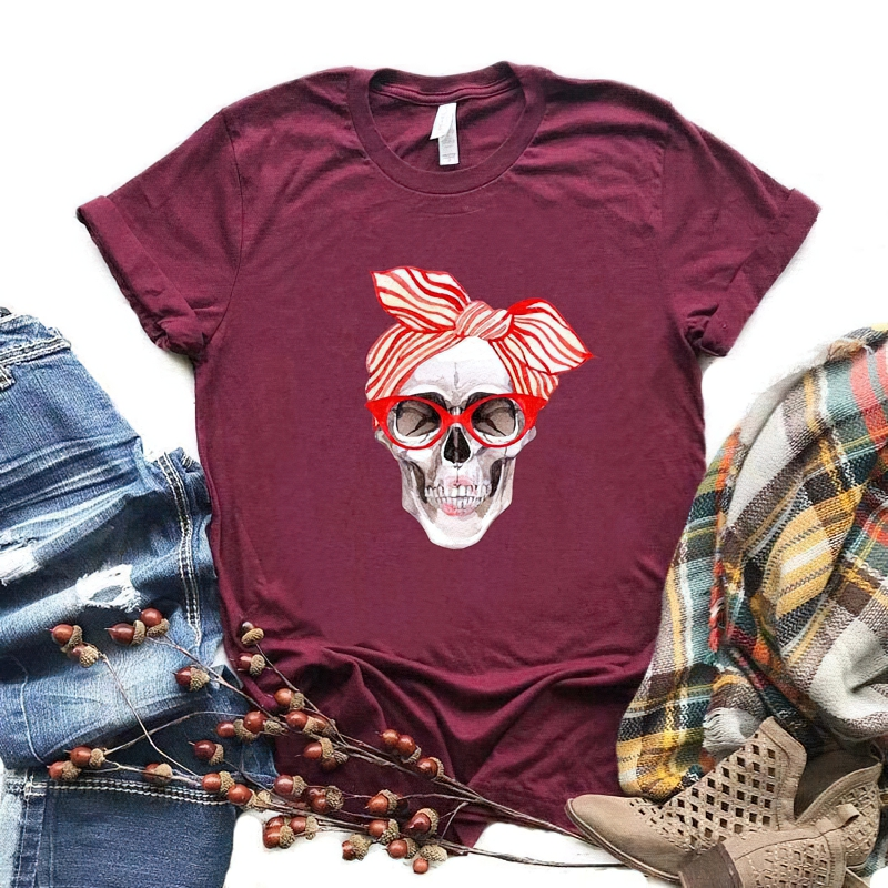 Stylish women's maroon t-shirt featuring a colorful skull print and a bow, perfect for casual rock-inspired outfits.