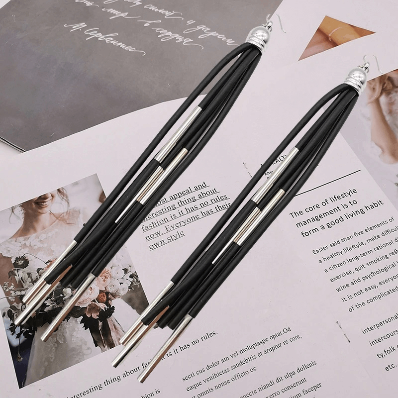 Stylish handmade black rubber long earrings, punk jewelry with sleek silver details, perfect for a bold fashion statement.