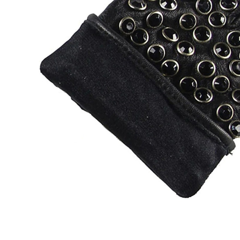 Close-up of semi-finger punk leather gloves with rhinestones for a stylish spring or autumn look.