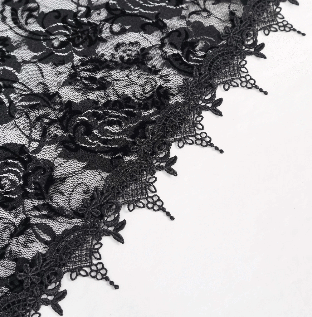 Close-up of intricate black lace with floral patterns and elegant trim, perfect for gothic fashion.