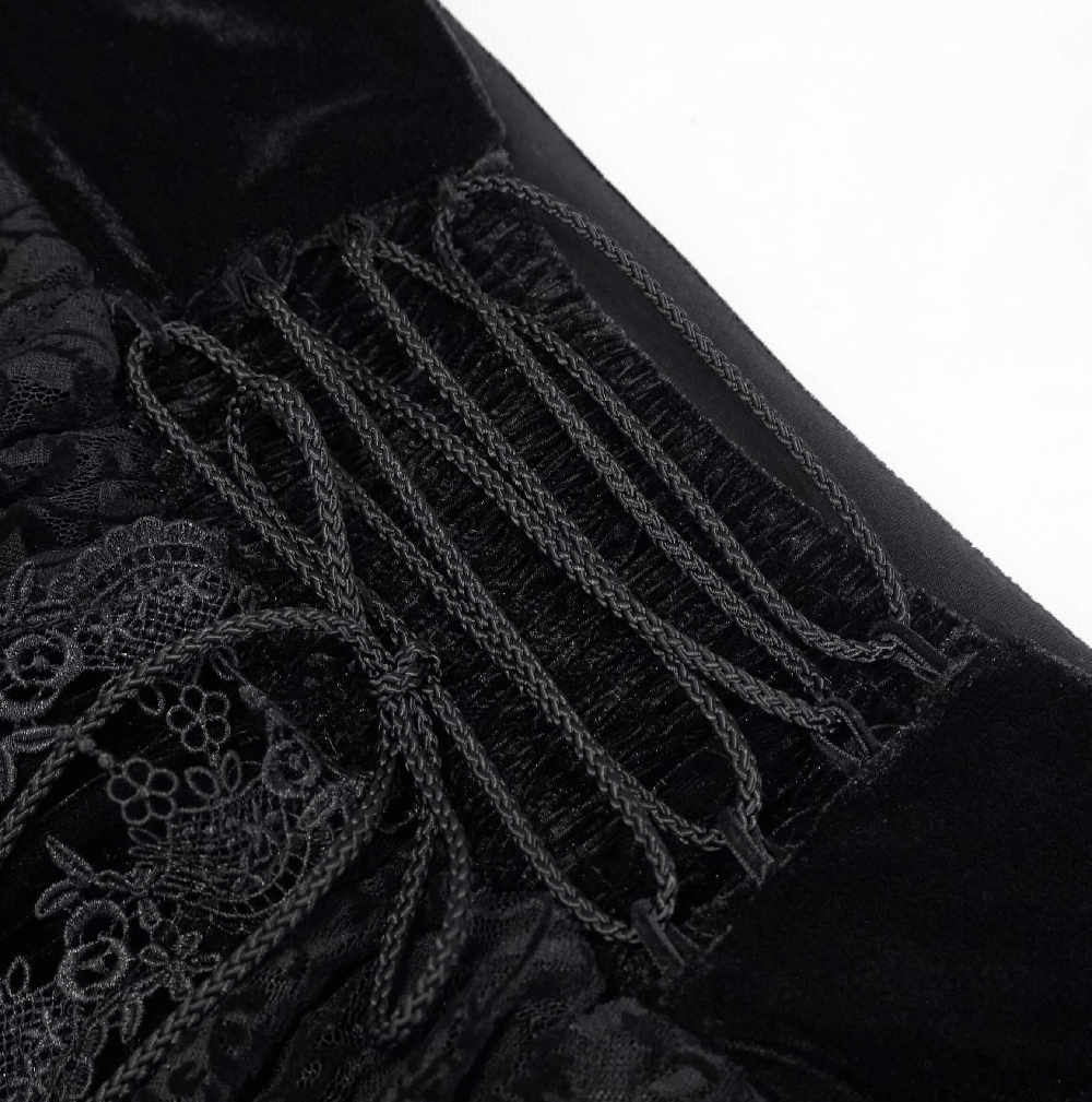 Close-up of the lace and velvet detailing on a women's vintage gothic long skirt.