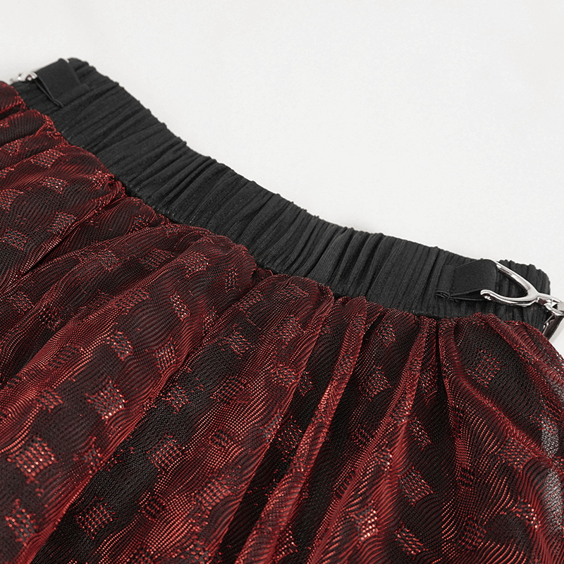 Close-up of the elastic waistband and layered mesh of a wine red grunge style women's skirt.
