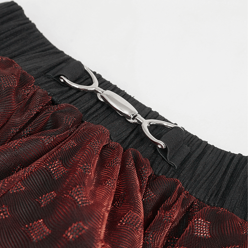 Close-up of the elastic waistband and clasp detail of a women’s wine red irregular layered mesh skirt.