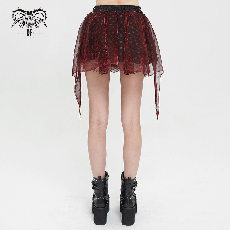 Back view of a women's wine red irregular layered mesh skirt in grunge style, paired with edgy black boots.