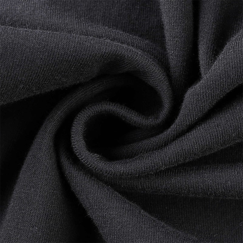Close-up of soft, high-quality black fabric ideal for an elegant gothic dress with a luxurious feel.