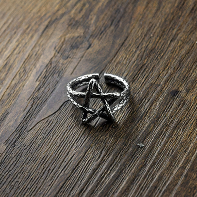 Five Star Open Retro Ring for Women in 925 Sterling Silver on a wooden background, showcasing its creative design.