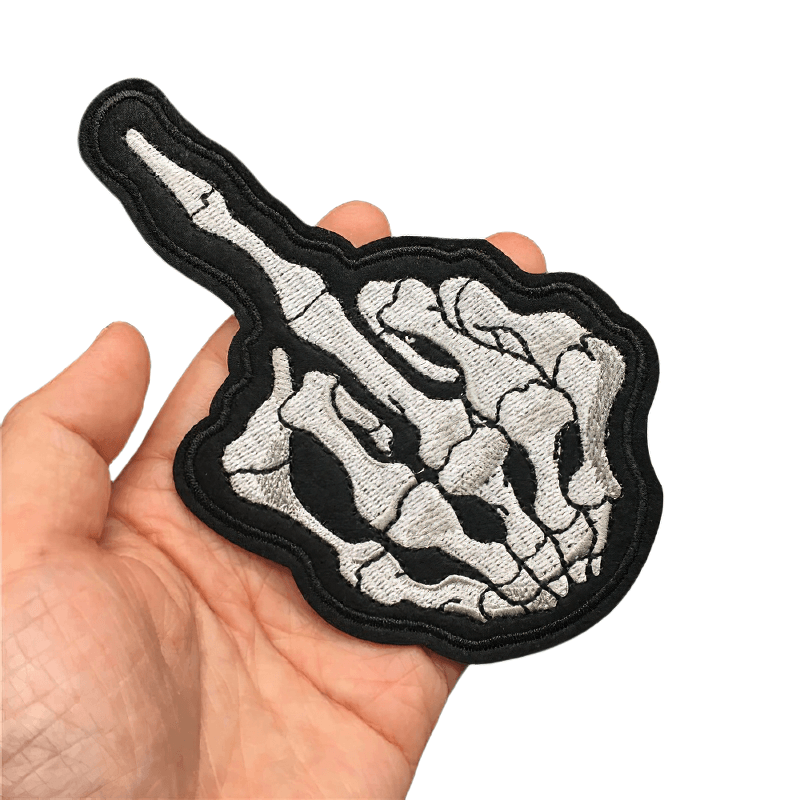 Unisex Flip Off bone hand patch in hand, showcasing gothic style accessory for alternative fashion.