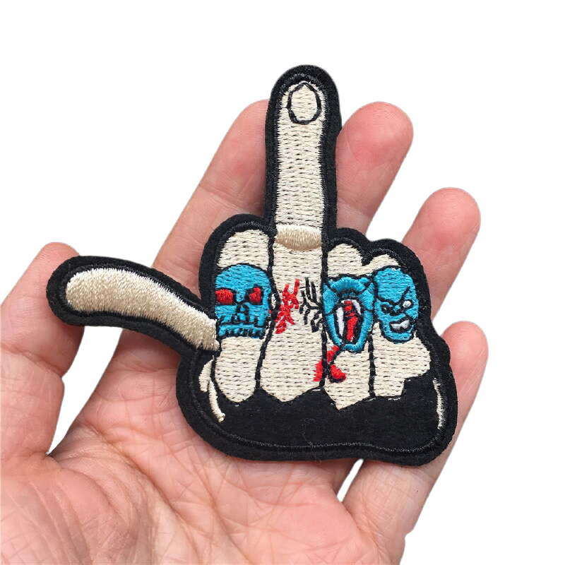 Unisex Gothic Flip Off Hand Patch held in hand, perfect for alternative fashion and clothing styles.
