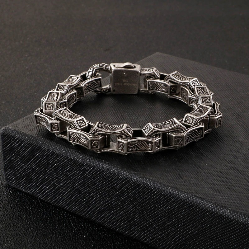 Vintage engraving stainless steel cuff bracelet showcasing unique punk style design and intricate patterns.