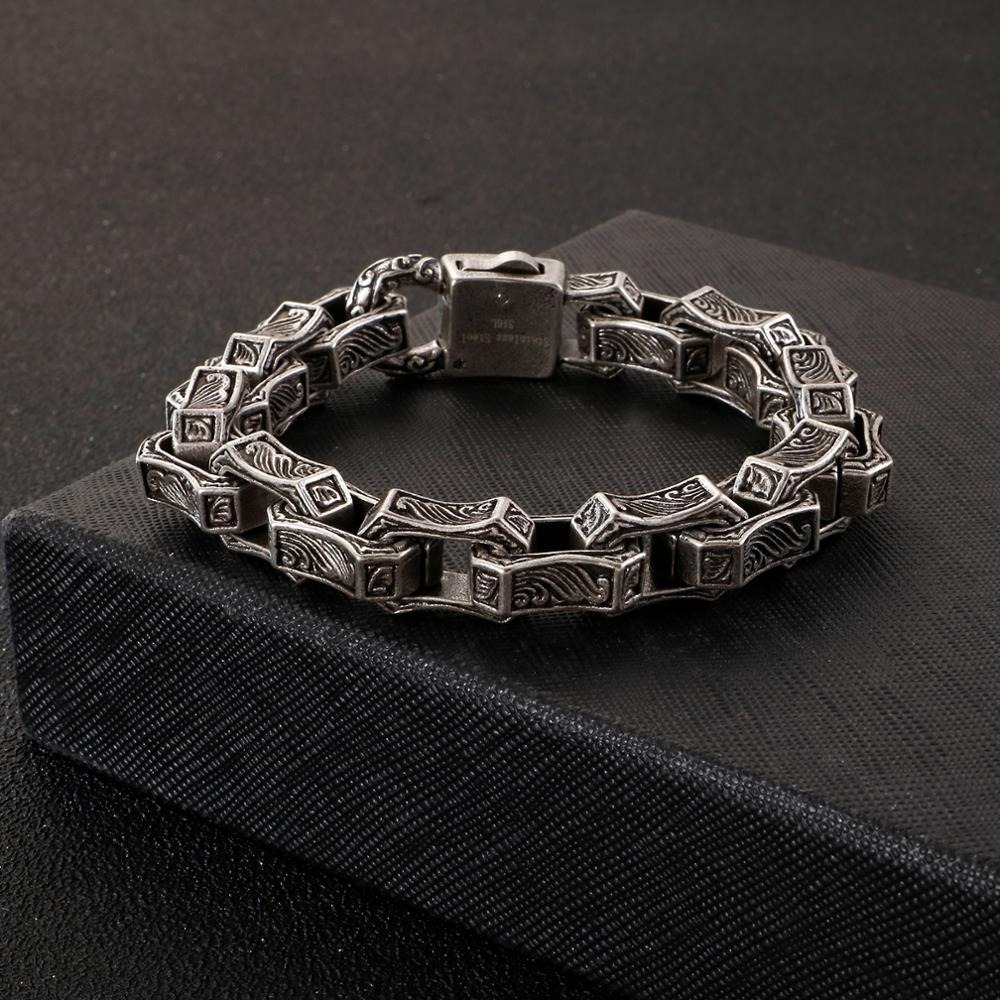 Men's vintage stainless steel cuff bracelet with intricate engraving, perfect for a punk style accessory.