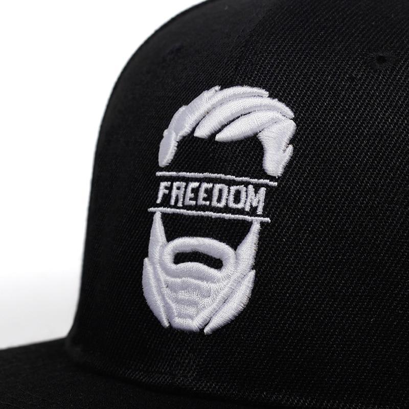 Close-up of freedom embroidery on a black baseball cap, showcasing stylish rock-inspired design for men and women.