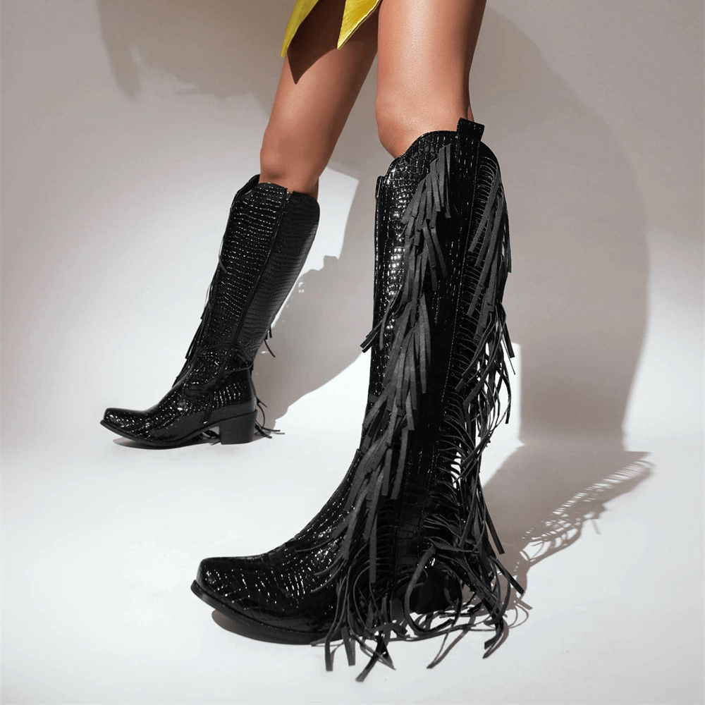 Stylish black fringed tassel knee-high vintage boots for women, perfect for an alternative fashion statement.