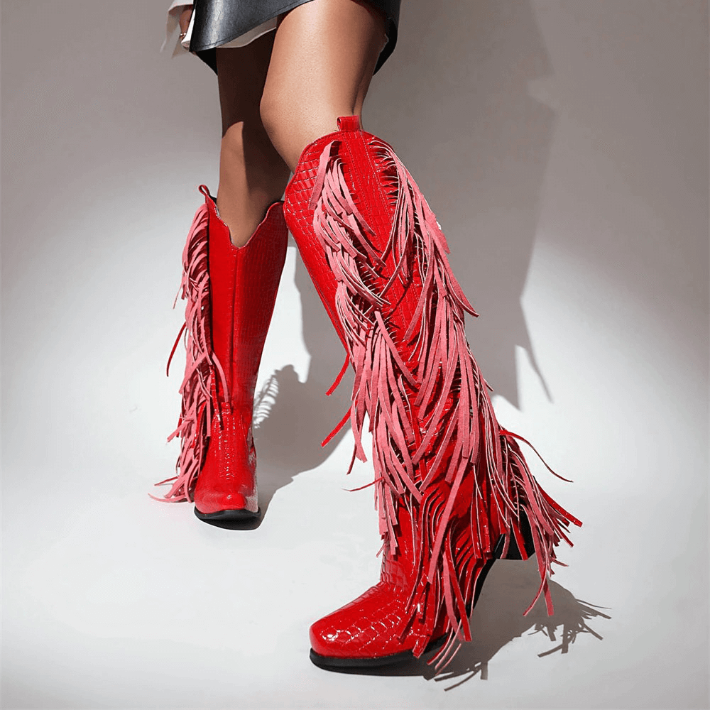Red high knee boots with fringes, stylish vintage alternative shoes for women, perfect for bold fashion statements.