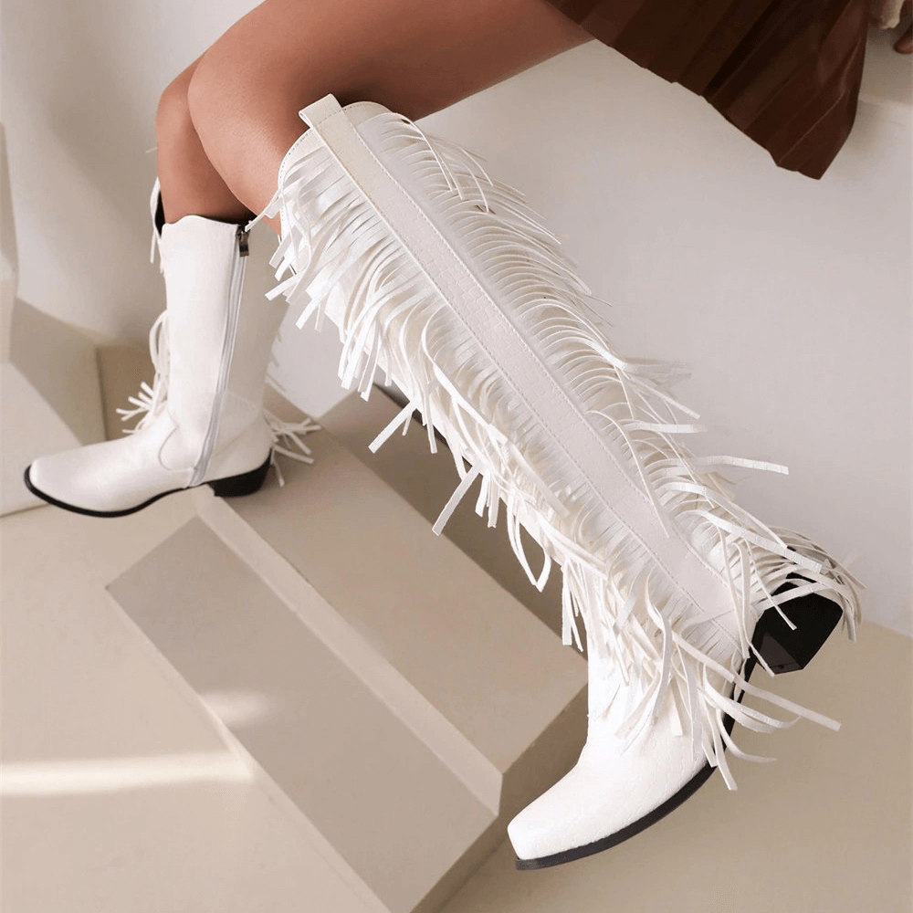 White fringed tassel knee-high boots for women, perfect for alternative fashion styles.
