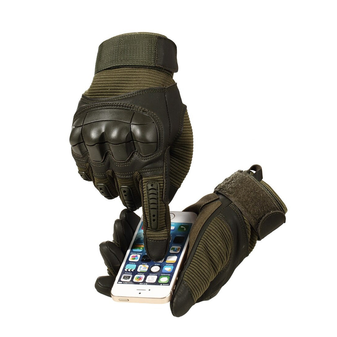 Military-style tactical gloves using a smartphone, showcasing touchscreen functionality in a winter setting.
