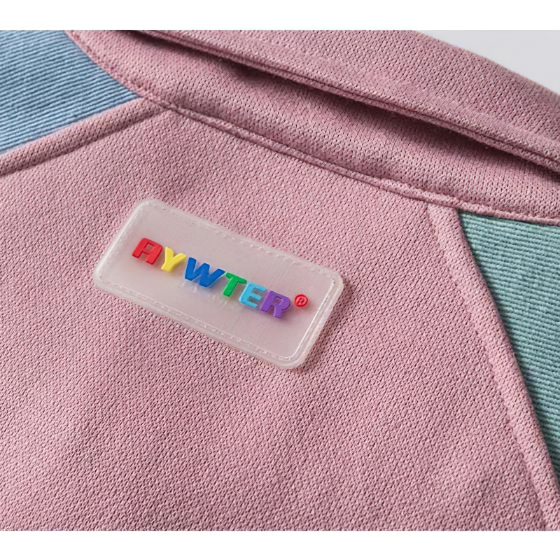 Close-up of the colorful patchwork label on the Furry Heart oversized jacket, showcasing modern casual style.