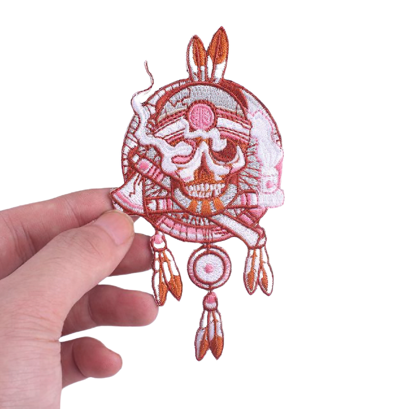 Fusible patch featuring an Indian skull with feathers, perfect for unisex rave outfits and alternative style accessories.