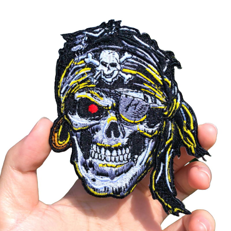 Fusible unisex patch featuring a pirate skull design, perfect for rave outfits and stylish clothing accessories.