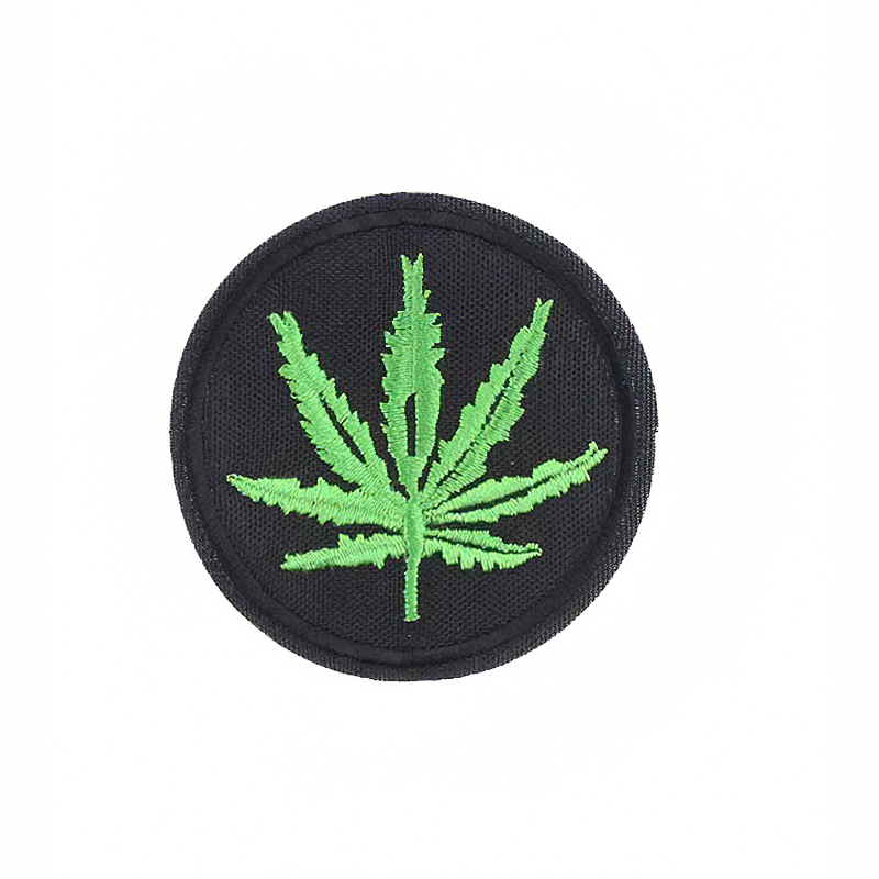 Ganja leaf print fusible patch on black background, an edgy accessory for alternative fashion lovers.