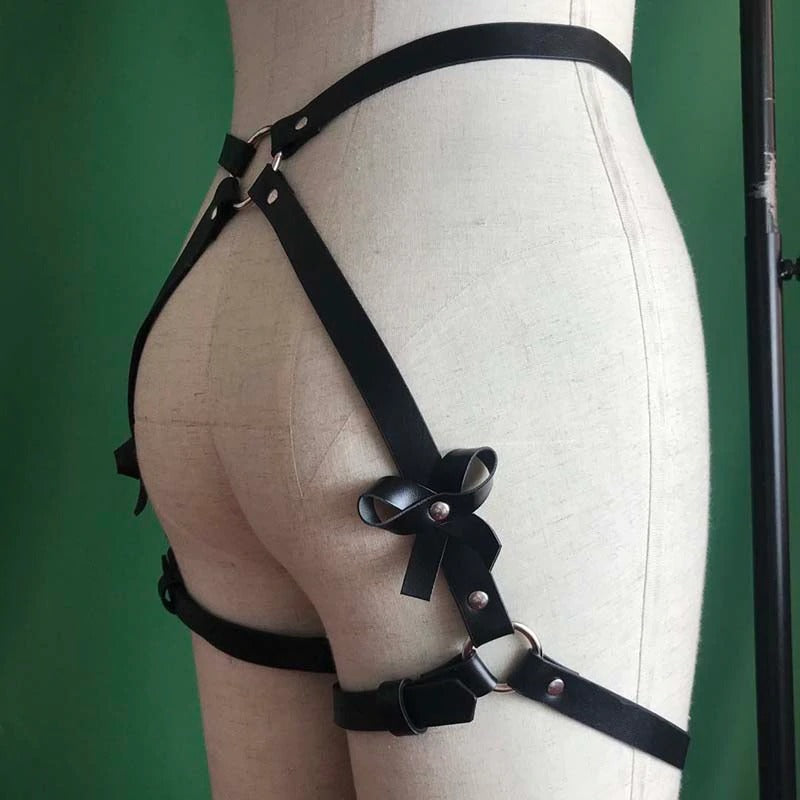 Leather leg garter body harness belt showcasing a gothic style with bows and steel rings, perfect for women's lingerie.
