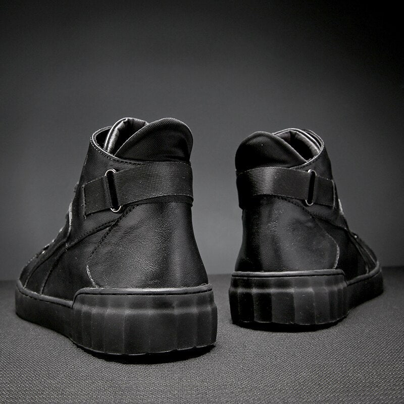 Back view of genuine leather alternative fashion sneakers for men, showcasing stylish black design and robust rubber outsole.