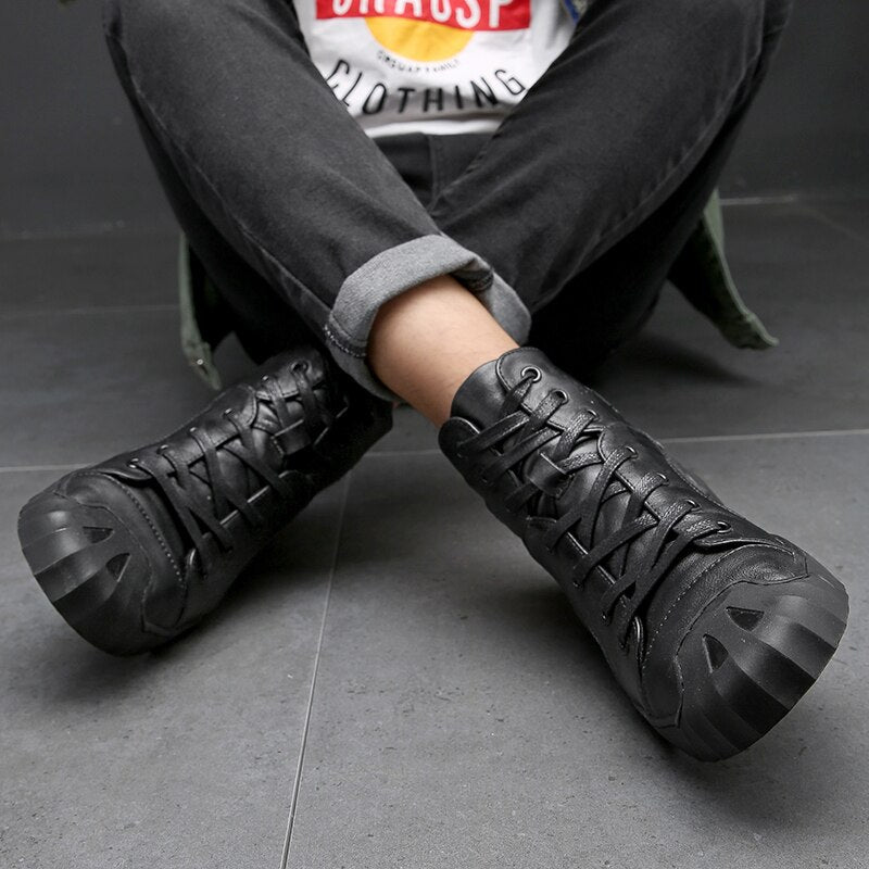 Genuine leather black sneakers for men, stylish and comfortable casual footwear with lace-up closure.