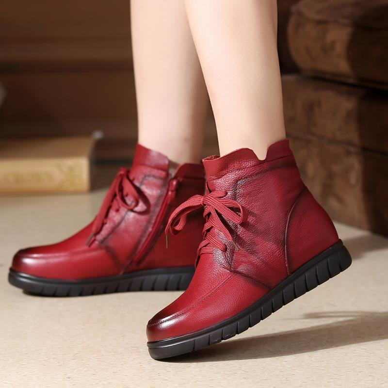 Stylish red genuine leather ankle boots with lace-up design and low sole, perfect for casual wear.