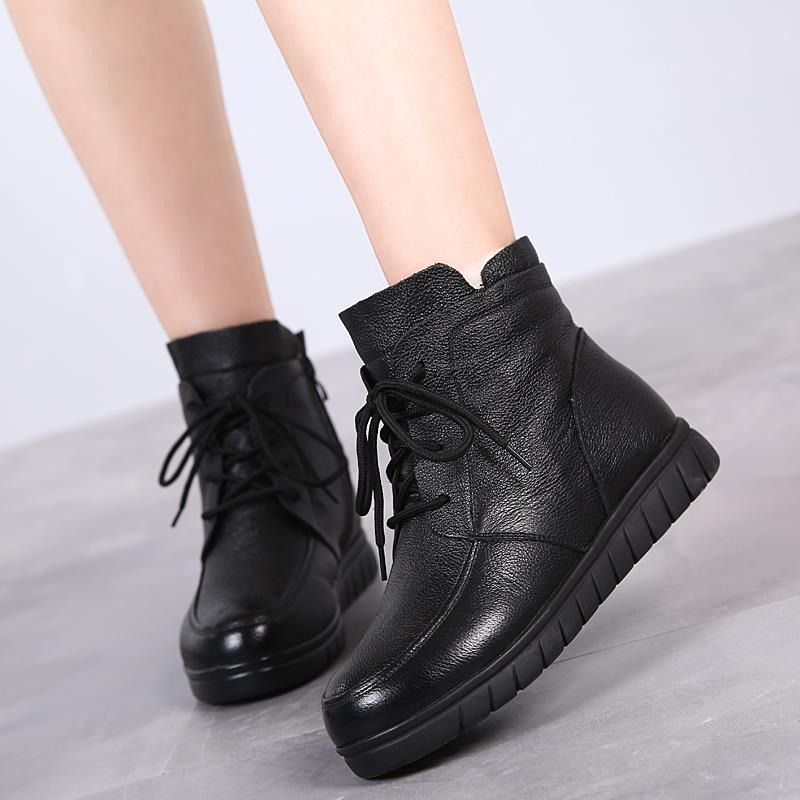Stylish women's genuine leather ankle boots in black with lace-up design and comfortable low sole.