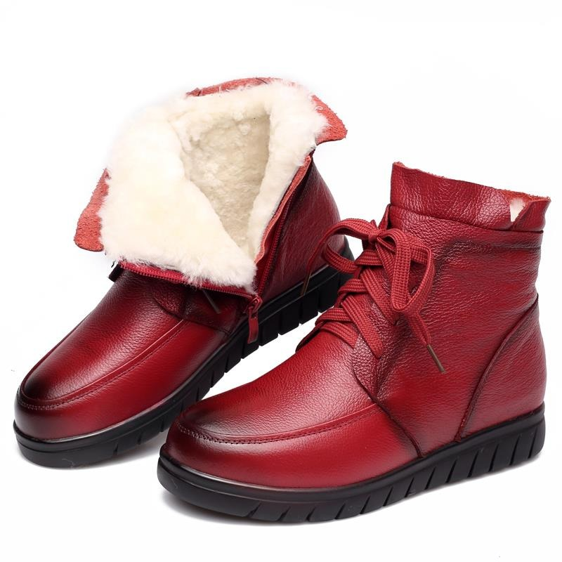 Red genuine leather ankle boots with a soft fur lining, perfect for casual winter style.