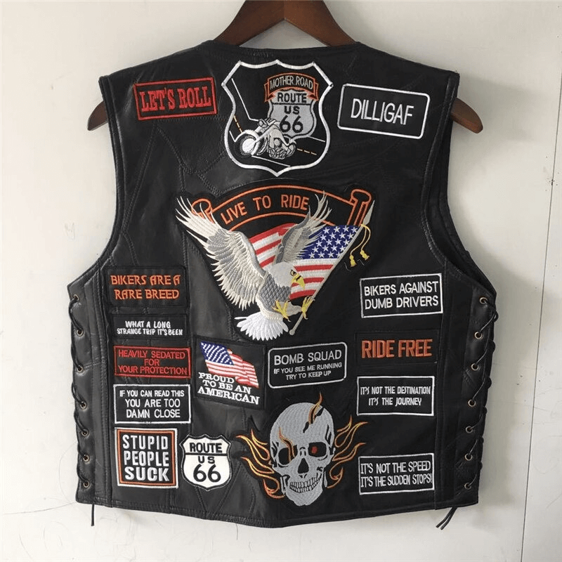 Genuine leather biker vest with rock patches, US flag, eagle, and skull design, perfect for edgy outfits.