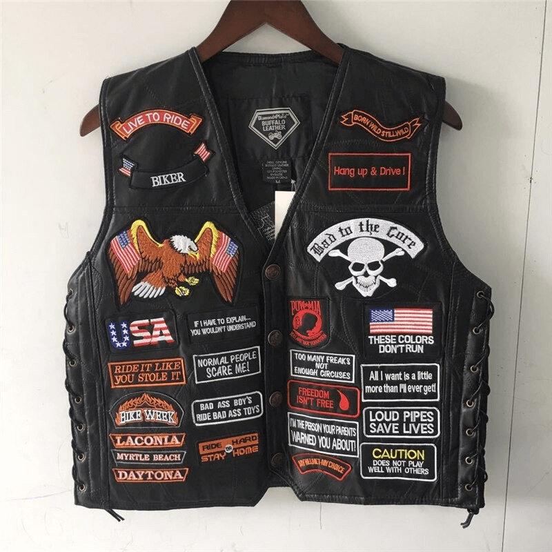 Genuine leather biker vest featuring rock-style patches, skull and eagle designs, perfect for edgy outfits.