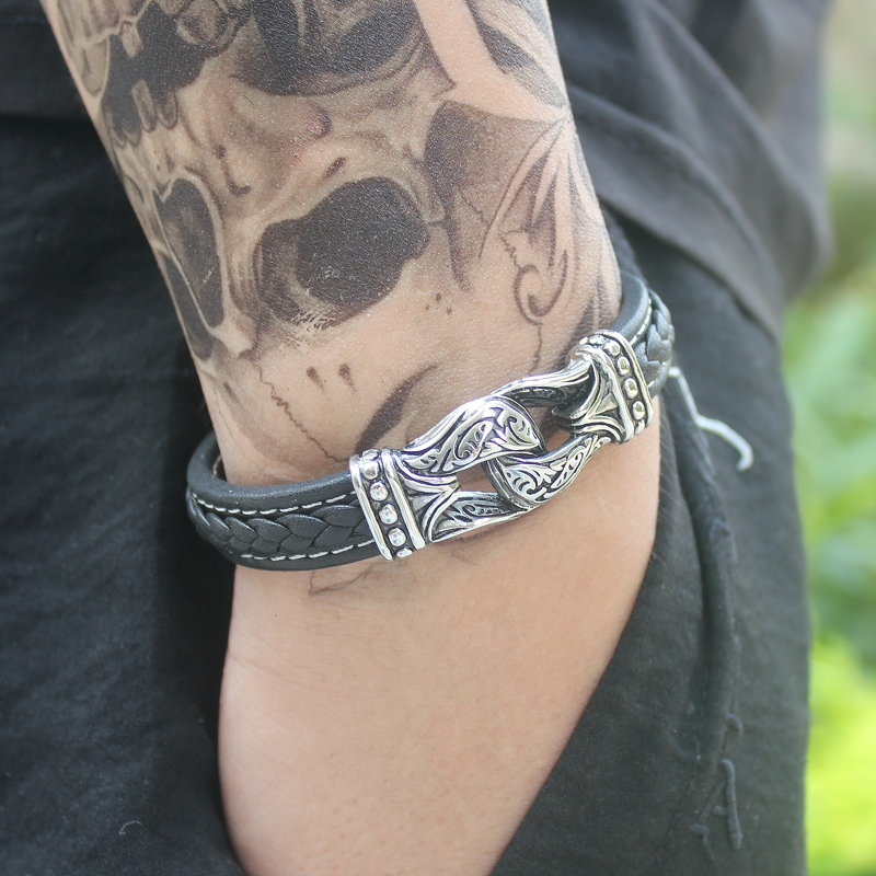 Gothic style genuine leather bracelet for men featuring stainless steel clasp, perfect accessory for edgy looks.