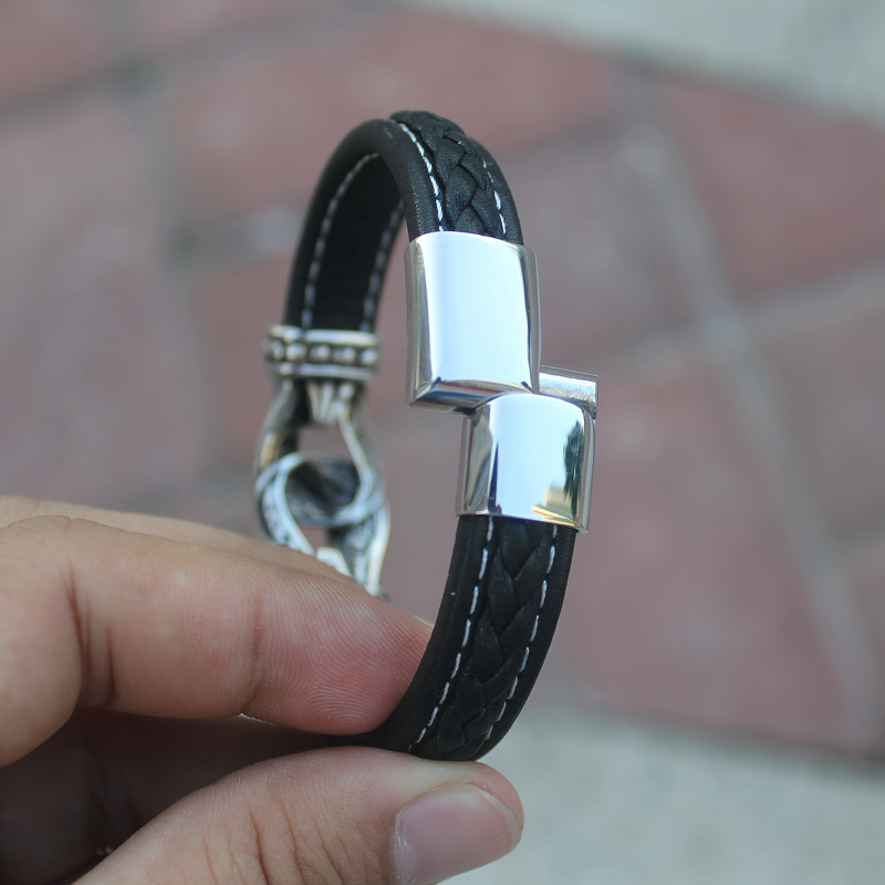 Stylish gothic stainless steel leather bracelet for men, crafted from genuine leather with a sleek silver accent.