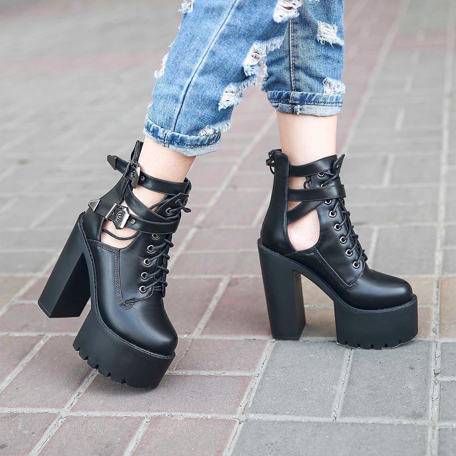 Trendy black platform ankle boots with chunky heels, zipper, and lace details, perfect for rocker outfits.