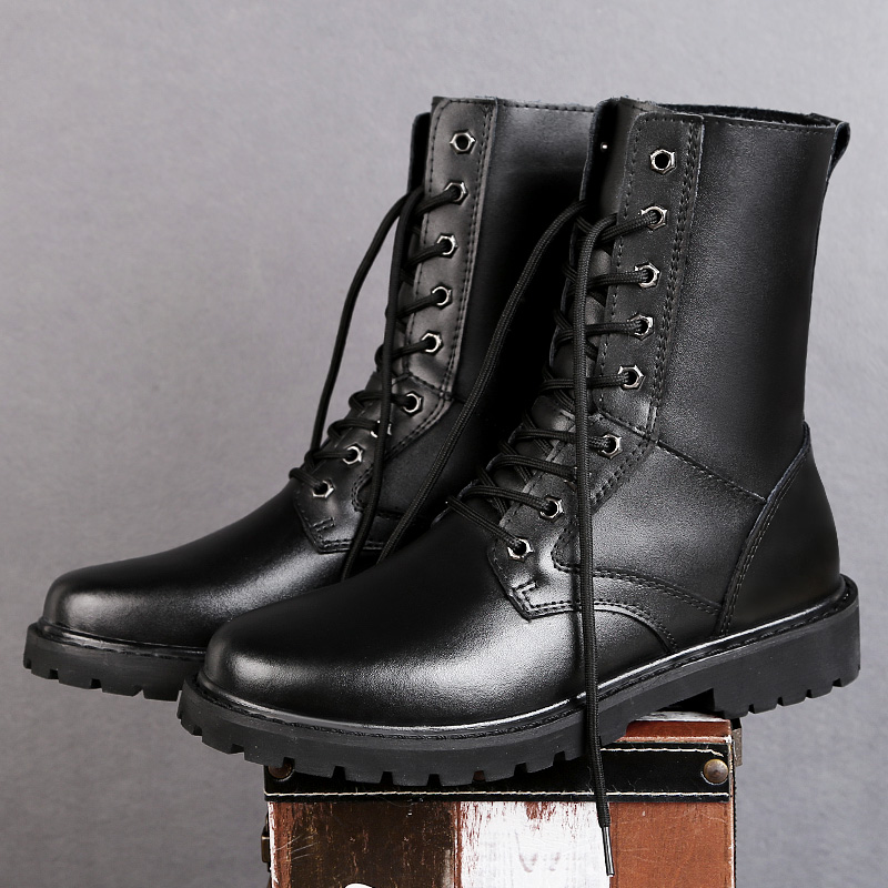 Stylish black leather lace-up high top boots on a wooden crate, perfect for winter wear.