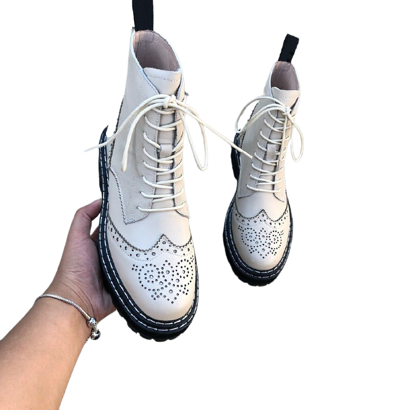 Genuine leather women's biker boots with hollow flowers and lace-up design, perfect for stylish outdoor activities.