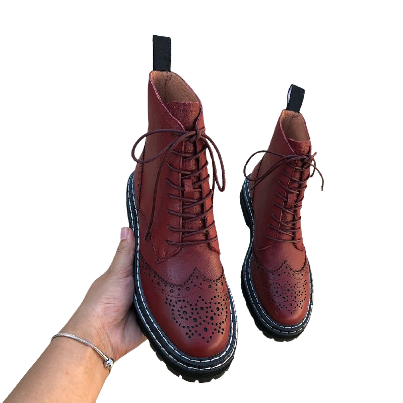 Genuine leather women's biker boots with lace-up closure and hollow out flower design, perfect for stylish outdoor adventures.