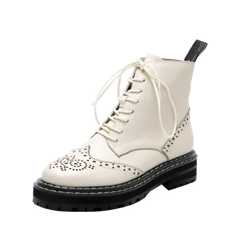 Stylish white genuine leather lady's boots with lace-up closure and decorative perforations.