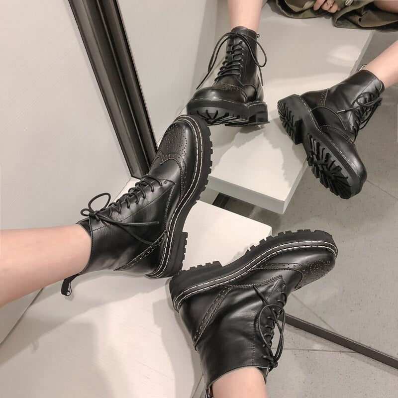 Genuine leather women's biker boots with lace-up design and unique flower patterns, perfect for various outdoor outfits.
