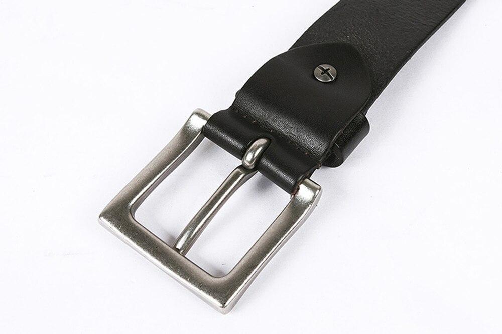 Close-up of genuine leather belt with stylish metal buckle, perfect for a punk rock look.