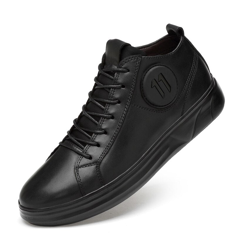 Genuine leather mid-top men's sneakers, perfect for alternative fashion and rave outfits, showcasing a sleek black design.