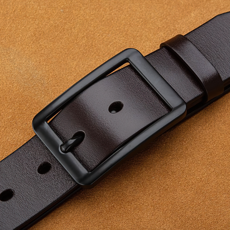 Genuine leather pin buckle adjustable belt close-up on tan background, perfect for unisex rock style outfits.