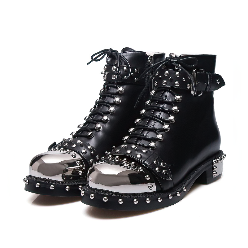 Stylish women's genuine leather punk rock boots with rivets, chains, and a shiny cap toe, perfect for a bold look.