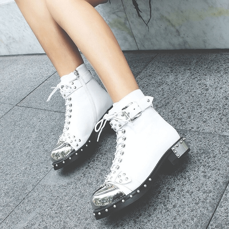Stylish women's white punk rock boots with studs and silver accents, perfect for a bold fashion statement.