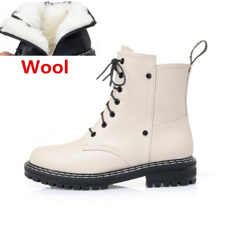 Genuine leather snow ankle boots for women featuring warm wool lining and sturdy rubber sole, perfect for autumn and winter.