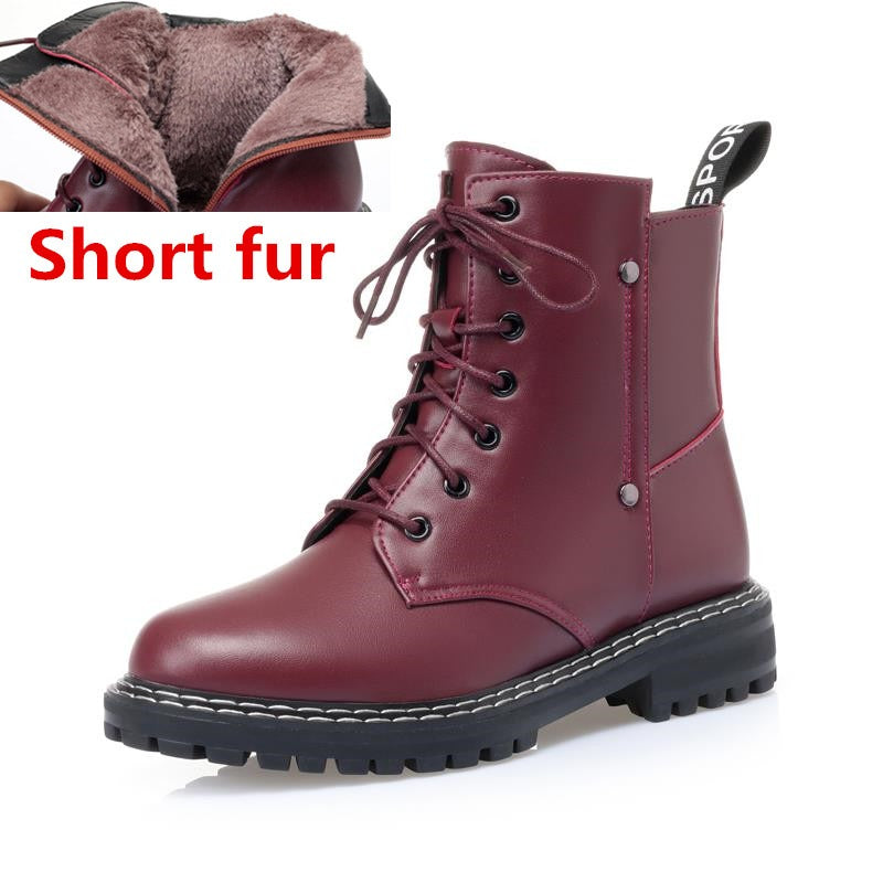 Stylish burgundy snow ankle boots for women with short fur lining and chunky sole for warmth and comfort.