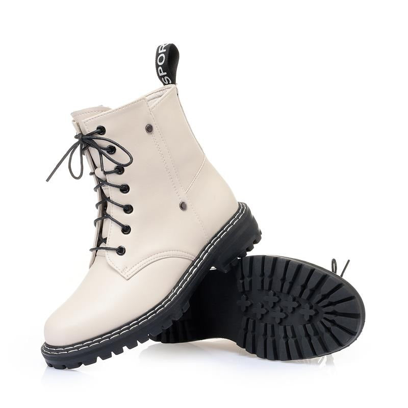 Stylish beige snow ankle boots for women with a chunky black rubber sole and lace-up design.