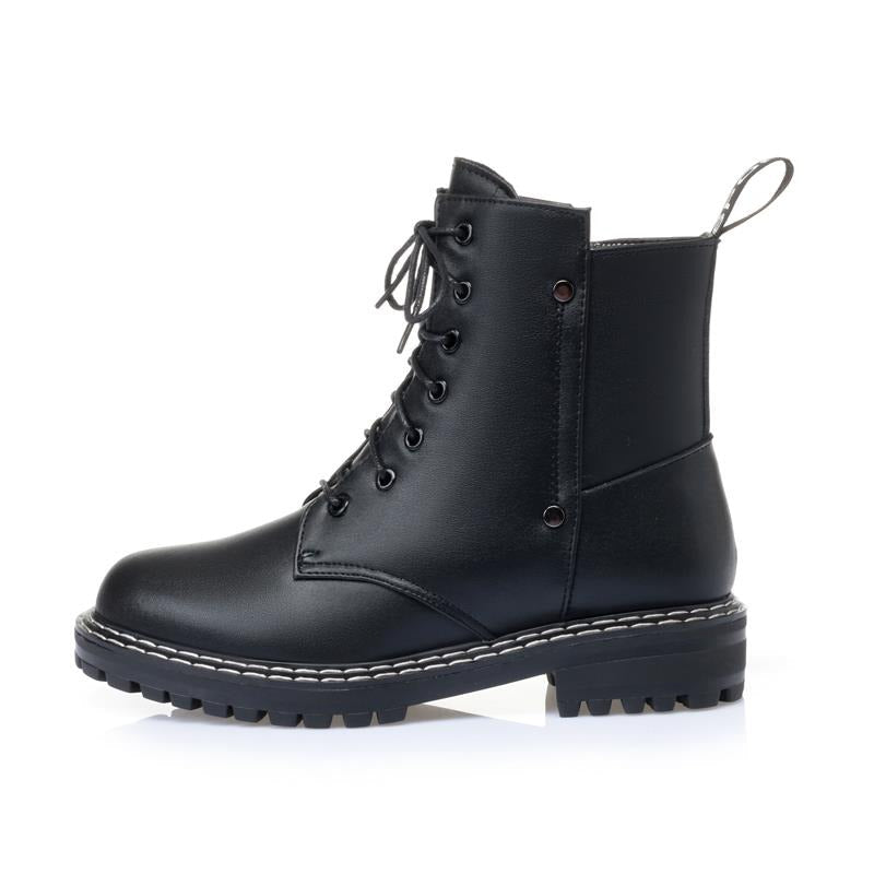 Black genuine leather snow ankle boots for women with chunky rubber sole and lace-up design, perfect for autumn and winter wear.